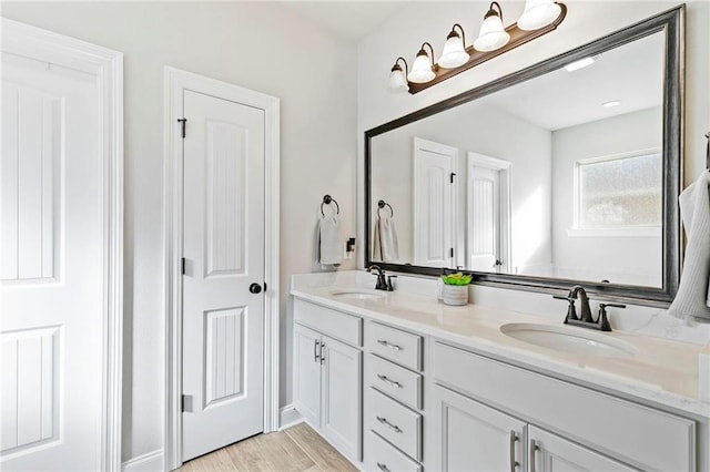 bathroom with vanity and wood-type flooring