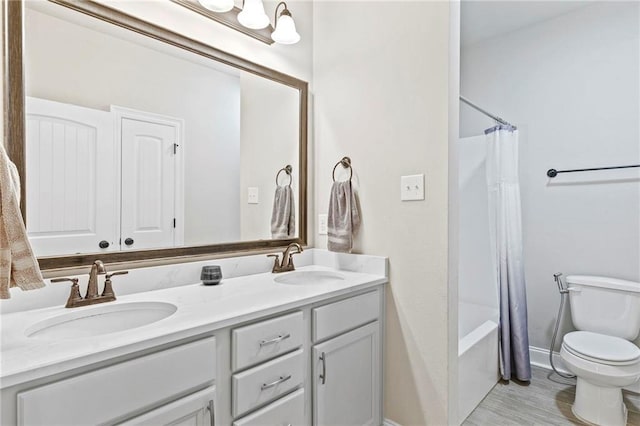 full bathroom with vanity, toilet, shower / tub combo, and wood-type flooring