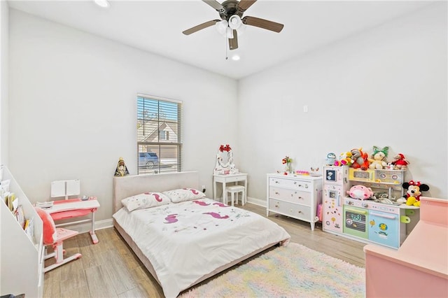 bedroom featuring hardwood / wood-style floors and ceiling fan