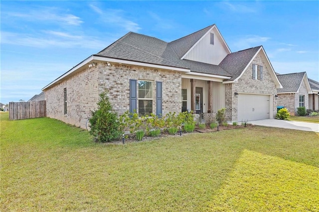 view of front of home featuring a front yard and a garage