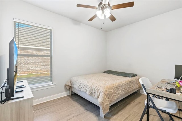 bedroom with ceiling fan and light wood-type flooring