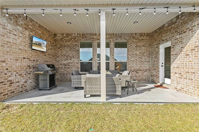 view of patio / terrace with an outdoor living space and area for grilling