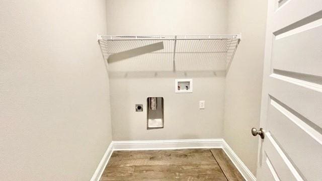 clothes washing area featuring washer hookup, hookup for an electric dryer, and hardwood / wood-style floors