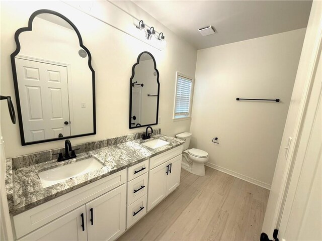 755 Cadillac Ave, Dauphin Island, AL 36528 - full bathroom with wood finished floors and double vanity