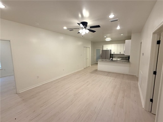 755 Cadillac Ave, Dauphin Island, AL 36528 - unfurnished living room featuring light wood-style floors, ceiling fan, and recessed lighting