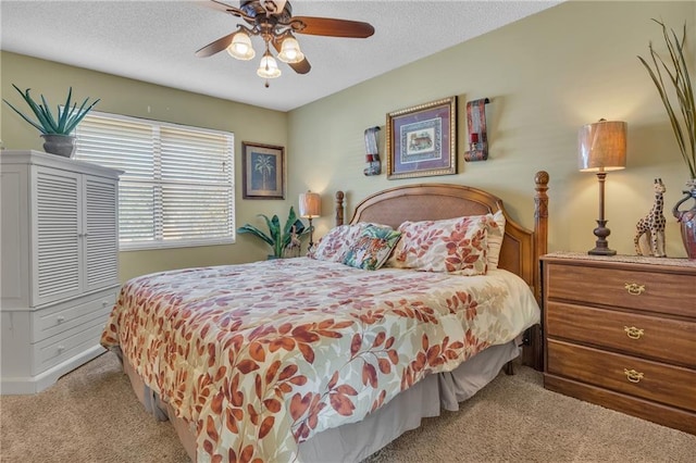 25293 Perdido Beach Blvd Unit 2, Orange Beach, AL 36561 - carpeted bedroom featuring a ceiling fan and a textured ceiling
