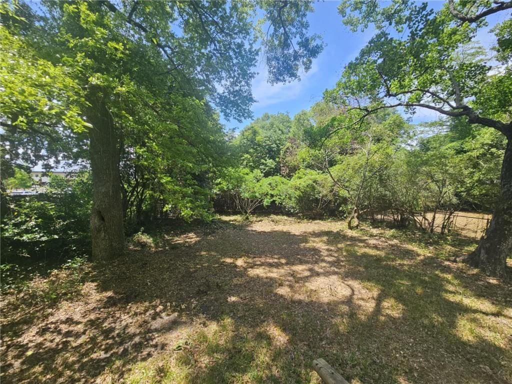 view of landscape with a forest view