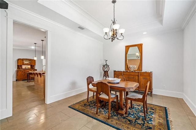 dining space with a notable chandelier, light tile patterned floors, ornamental molding, and a raised ceiling