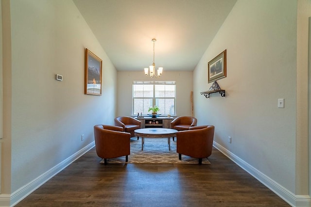 living area with baseboards, vaulted ceiling, dark wood-style floors, and a notable chandelier