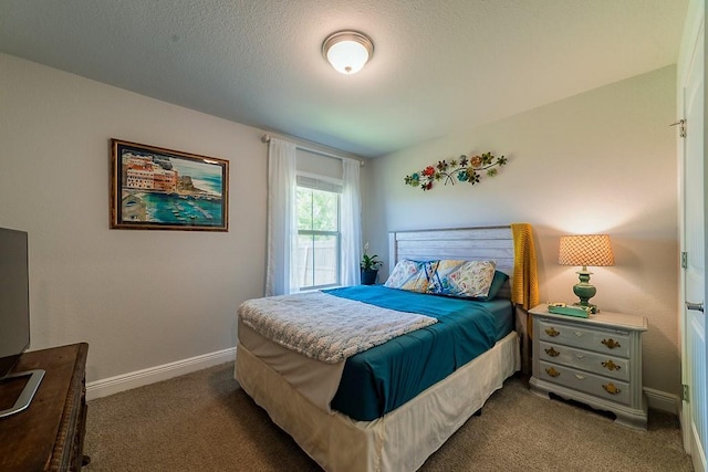 bedroom with carpet floors and baseboards
