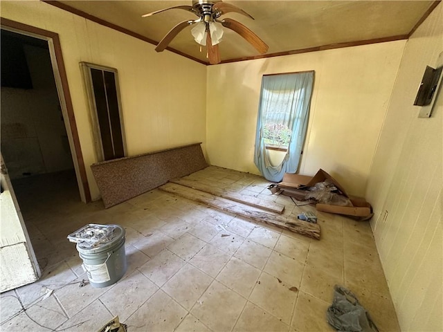 unfurnished bedroom featuring tile flooring, ornamental molding, and ceiling fan