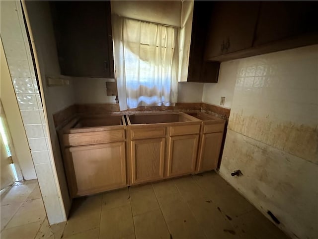 kitchen featuring light tile floors