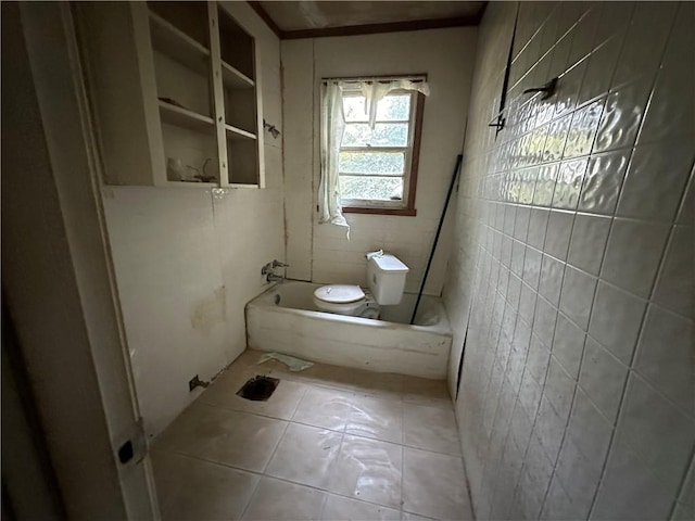 bathroom featuring tile floors, toilet, and tile walls