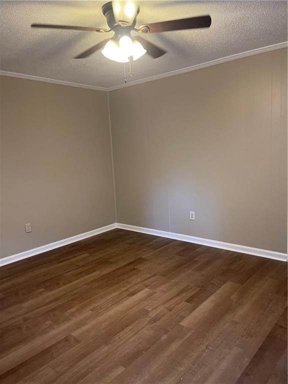 empty room with crown molding, ceiling fan, dark hardwood / wood-style floors, and a textured ceiling