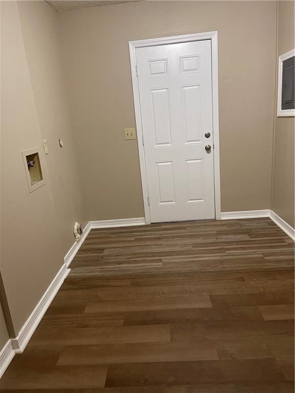 interior space featuring hookup for a washing machine and dark hardwood / wood-style floors