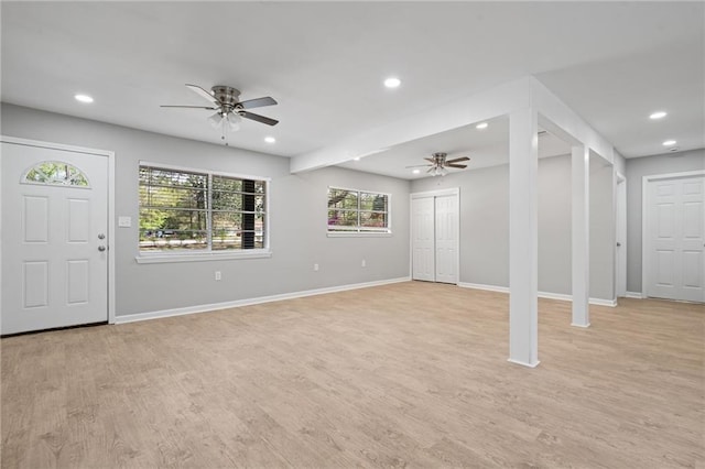 interior space with baseboards, light wood-type flooring, recessed lighting, and a ceiling fan