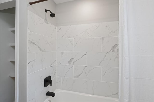 bathroom with shower / bathtub combination with curtain