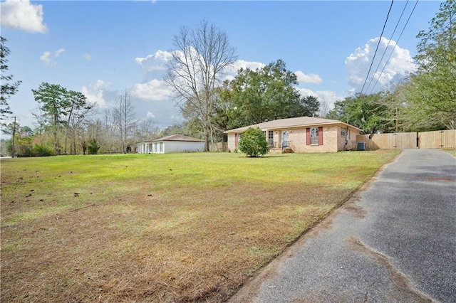 view of front of house featuring a front yard and fence