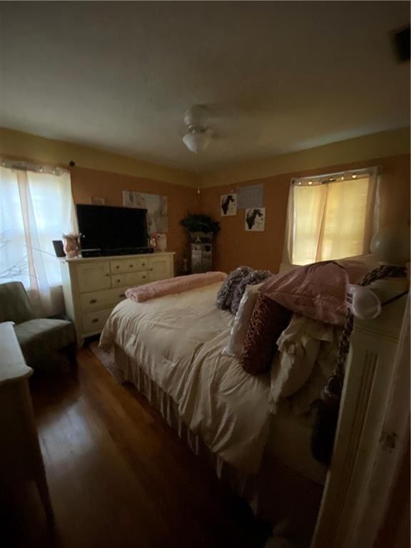 bedroom featuring dark hardwood / wood-style floors and ceiling fan