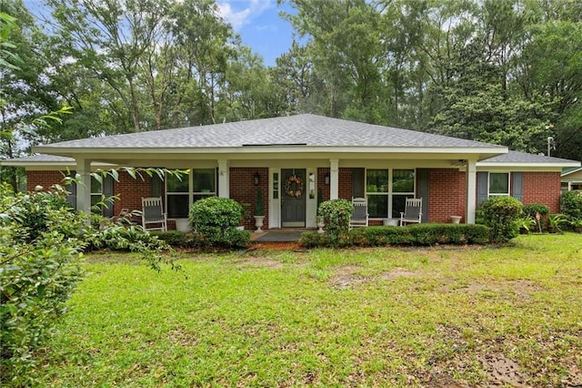 12850 Saeger Rd, Grand Bay, AL 36541 - ranch-style house featuring covered porch, a front lawn, and brick siding