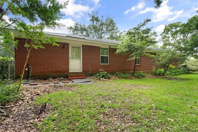 12850 Saeger Rd, Grand Bay, AL 36541 - view of front of home featuring entry steps, a front yard, and brick siding
