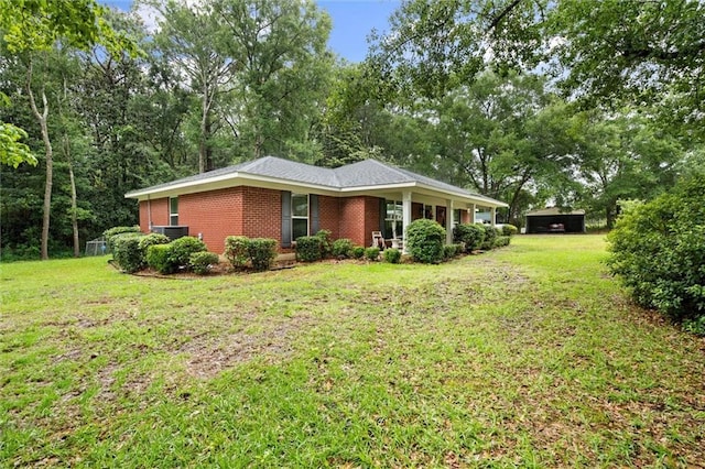 12850 Saeger Rd, Grand Bay, AL 36541 - single story home with brick siding, a front lawn, and view of scattered trees