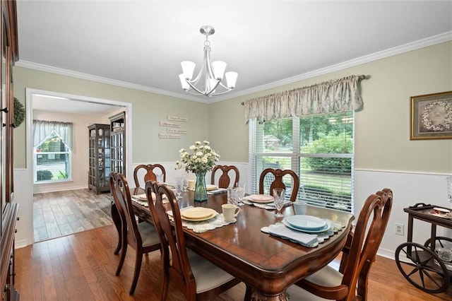 12850 Saeger Rd, Grand Bay, AL 36541 - dining room with ornamental molding, a chandelier, wainscoting, and wood finished floors