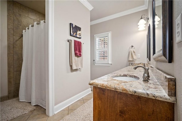 2217 Shandwick Dr, Mobile, AL 36695 - bathroom with tile patterned floors, crown molding, tiled shower, double vanity, and baseboards