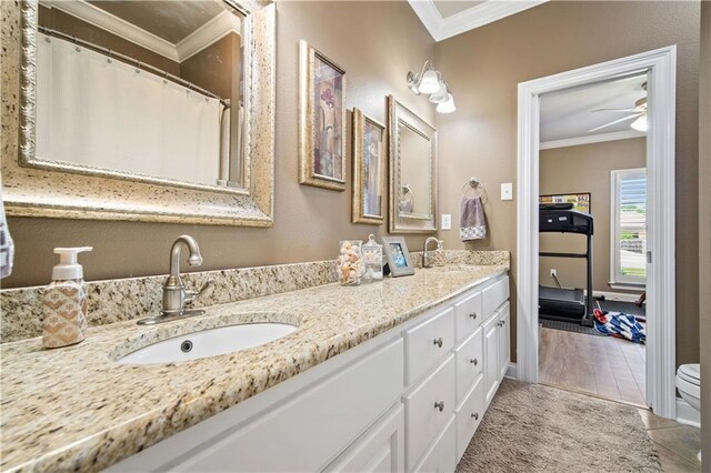 2217 Shandwick Dr, Mobile, AL 36695 - bathroom featuring ornamental molding, double vanity, a ceiling fan, tile patterned floors, and toilet
