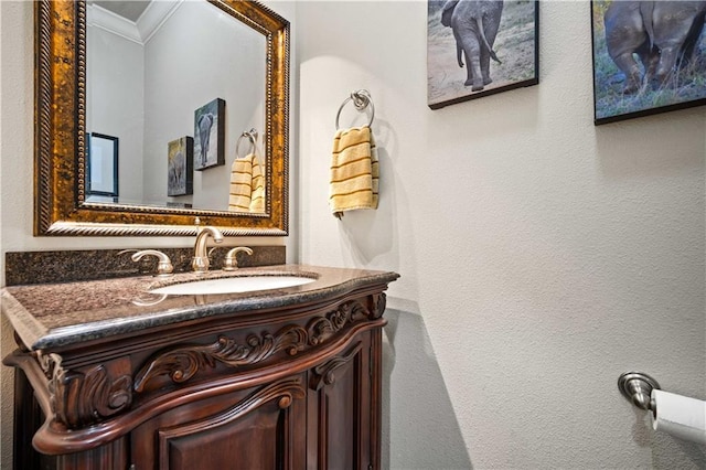 2217 Shandwick Dr, Mobile, AL 36695 - bathroom featuring ornamental molding, vanity, and a textured wall