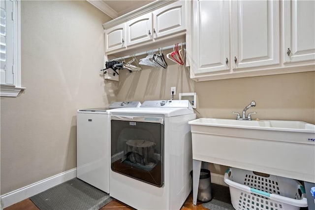 2217 Shandwick Dr, Mobile, AL 36695 - laundry room with washer and dryer, cabinet space, and baseboards