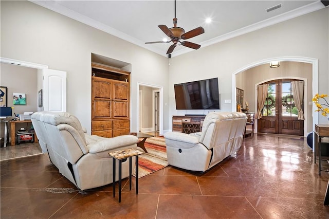 2217 Shandwick Dr, Mobile, AL 36695 - living room featuring french doors, a towering ceiling, ceiling fan, ornamental molding, and arched walkways