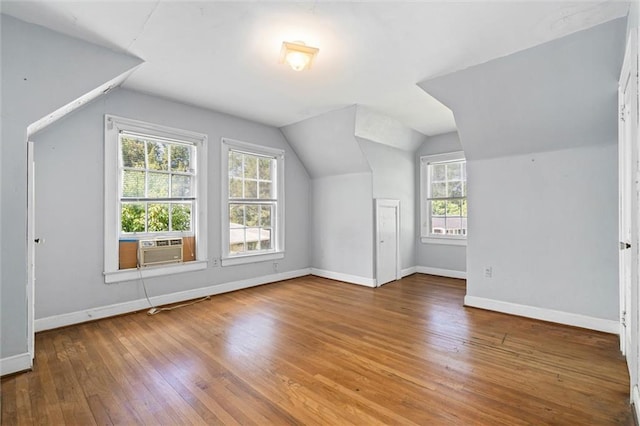 25 Benedict Pl, Mobile, AL 36606 - additional living space featuring plenty of natural light, baseboards, hardwood / wood-style floors, lofted ceiling, and cooling unit