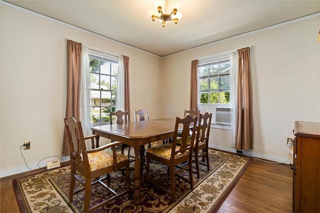 25 Benedict Pl, Mobile, AL 36606 - dining room featuring plenty of natural light, wood finished floors, a chandelier, baseboards, and ornamental molding