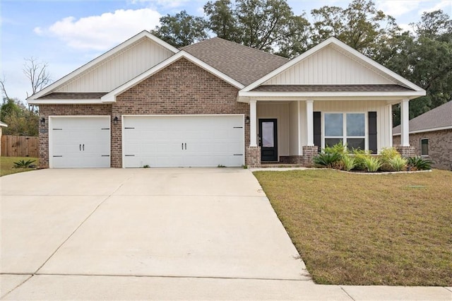 craftsman-style house featuring a front lawn and a garage