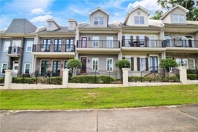 101 Fairhope Ct N Unit 16, Fairhope, AL 36532 - view of front of home featuring a balcony and brick siding