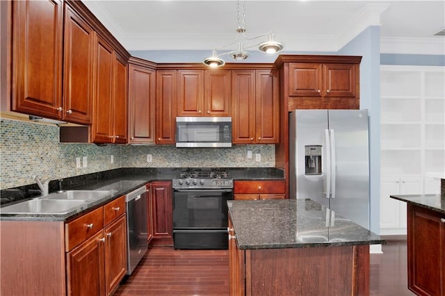 101 Fairhope Ct N Unit 16, Fairhope, AL 36532 - kitchen with stainless steel appliances, a sink, ornamental molding, tasteful backsplash, and hanging light fixtures