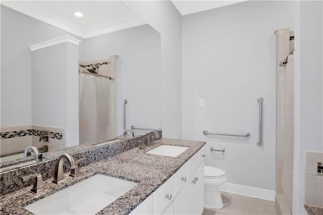 101 Fairhope Ct N Unit 16, Fairhope, AL 36532 - bathroom with double vanity, toilet, tiled shower, and baseboards