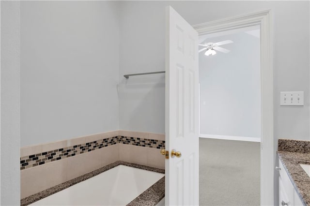 101 Fairhope Ct N Unit 16, Fairhope, AL 36532 - bathroom featuring vanity, a ceiling fan, and a tub to relax in