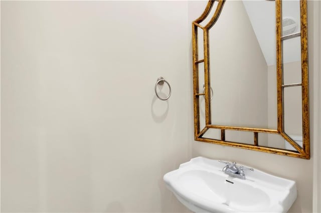101 Fairhope Ct N Unit 16, Fairhope, AL 36532 - bathroom featuring a sink and vaulted ceiling