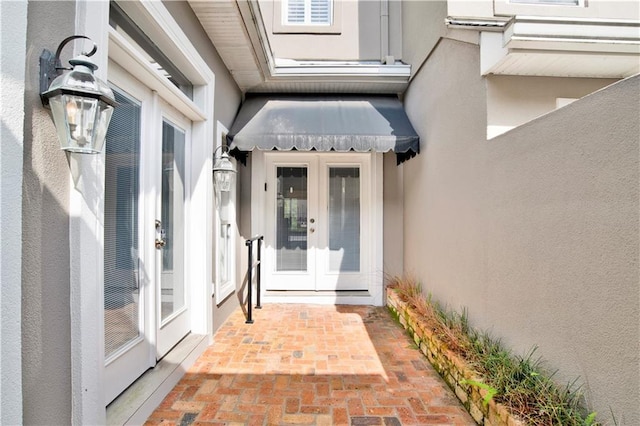 101 Fairhope Ct N Unit 16, Fairhope, AL 36532 - doorway to property with french doors and stucco siding