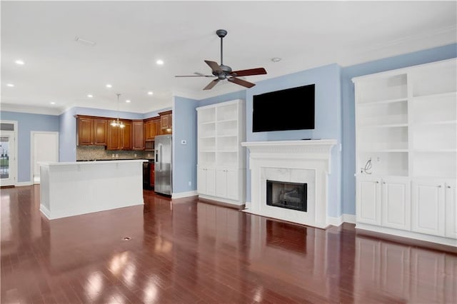 101 Fairhope Ct N Unit 16, Fairhope, AL 36532 - unfurnished living room with crown molding, ceiling fan, baseboards, recessed lighting, and a fireplace
