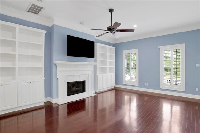 101 Fairhope Ct N Unit 16, Fairhope, AL 36532 - unfurnished living room with a ceiling fan, wood finished floors, baseboards, a fireplace, and ornamental molding