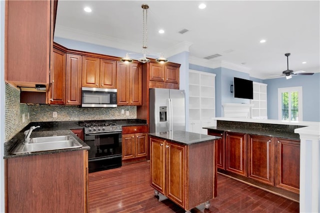101 Fairhope Ct N Unit 16, Fairhope, AL 36532 - kitchen with stainless steel appliances, a center island, a sink, crown molding, and dark wood-style floors