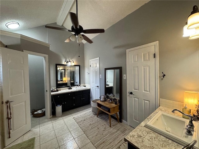 full bathroom with ceiling fan, a textured ceiling, tile patterned floors, vanity, and high vaulted ceiling