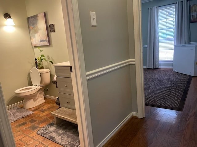 corridor featuring baseboards