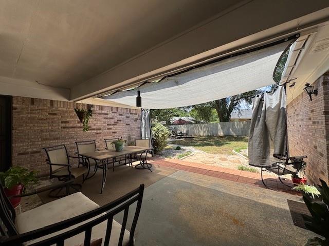 view of patio / terrace with a fenced backyard and outdoor dining space