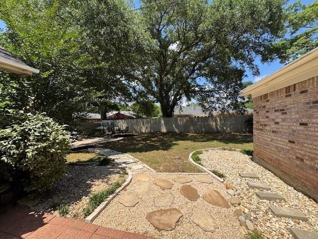 view of yard featuring a fenced backyard and a patio area