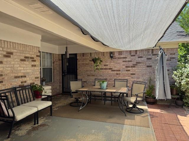 view of patio with outdoor dining space