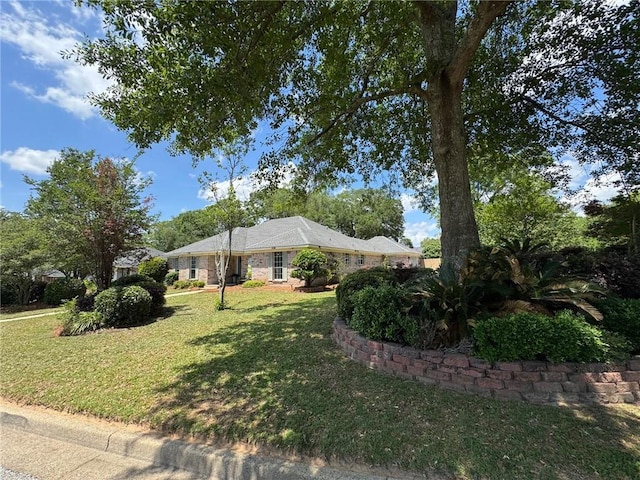 view of home's exterior with a yard